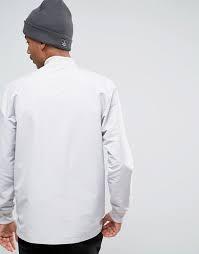 WOVEN TRACK TOP